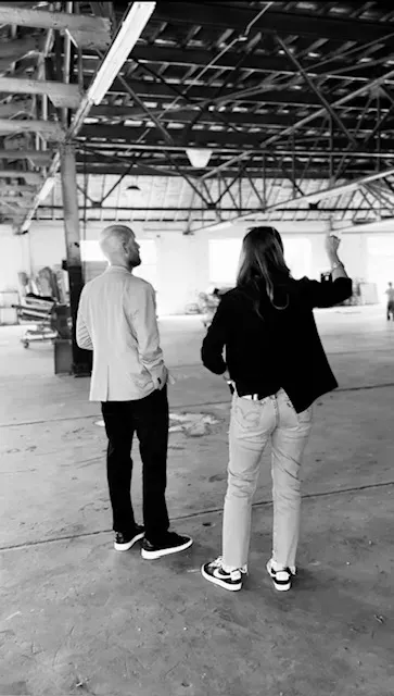 Man and woman in old building looking around, pondering the future of what is to come.
